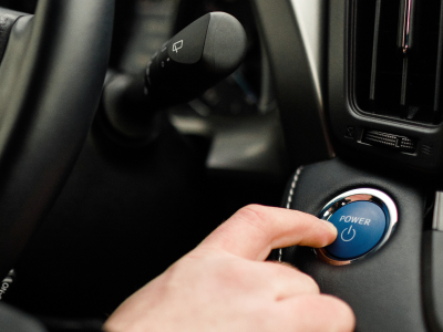 Person pushing a push start button