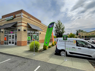 Corner store with van in a parking lot