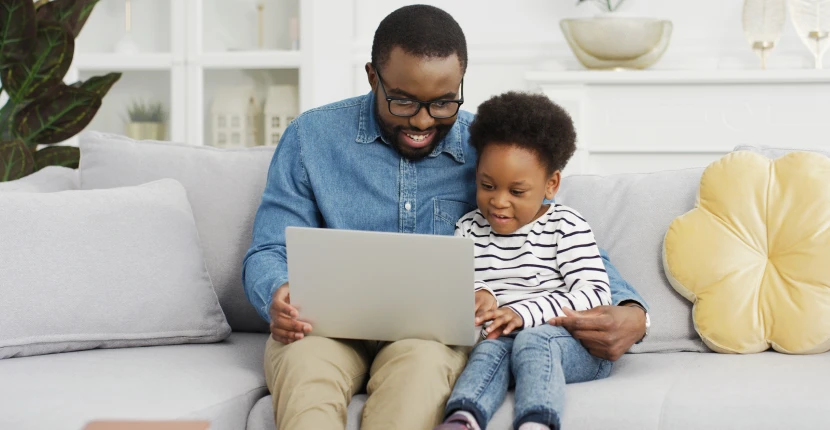 Father with child using a laptop