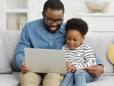 Father with child using a laptop