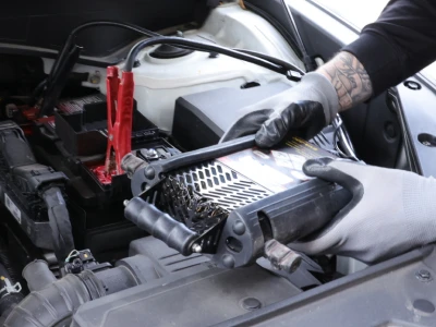 Using a battery tester on a car battery