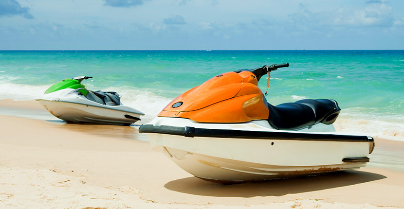 2 jet skis on a beach