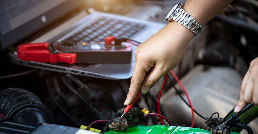 Using a multimeter to check on a battery