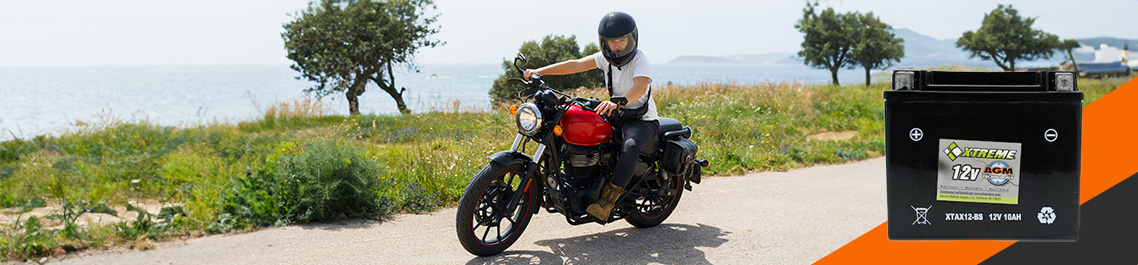 A person riding a motorcycle on road, AGM battery hero