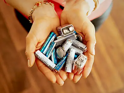 Holding a handful of batteries