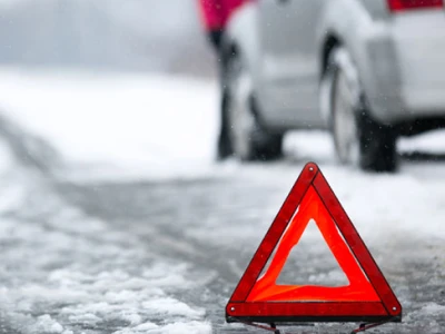 white car on side of the road in winter