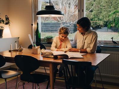 Parent and child sitting at the kitchen table